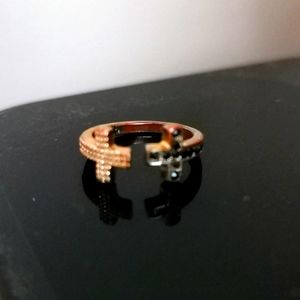 Gold and black cross ring